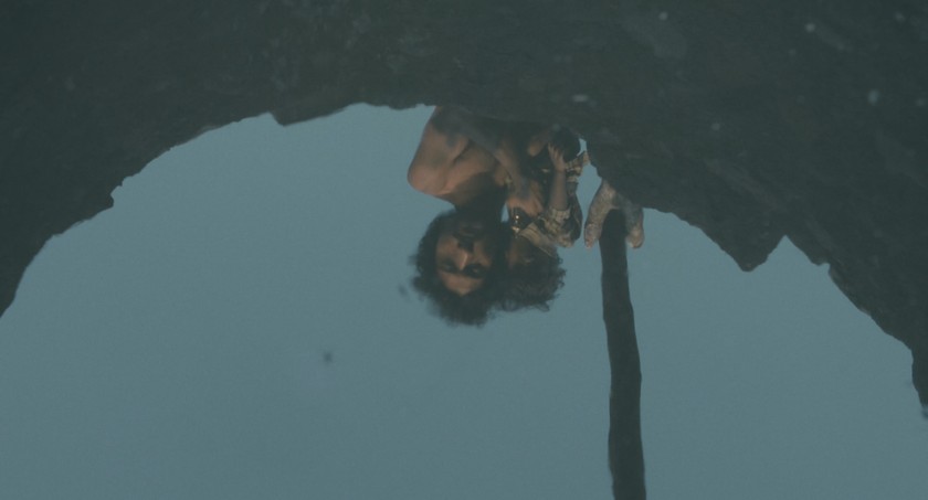 Shankar and the child looking into the well